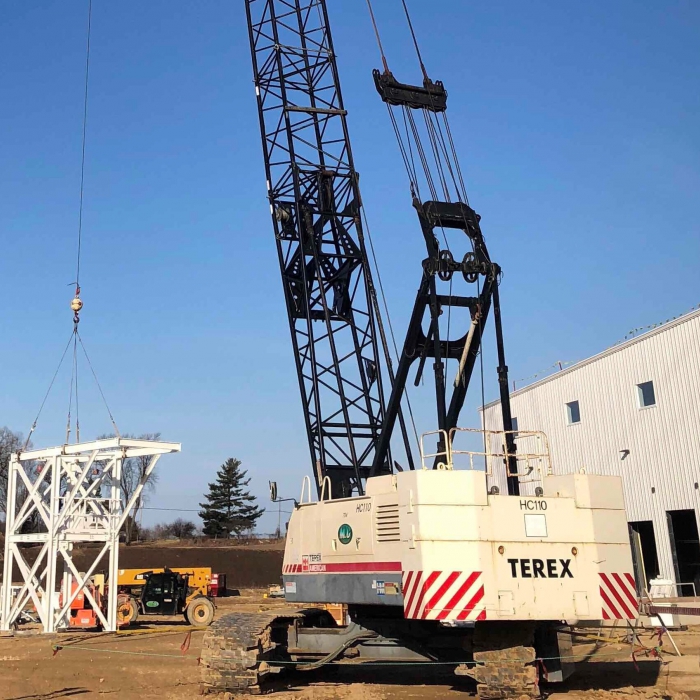 Construction crane holding up something.