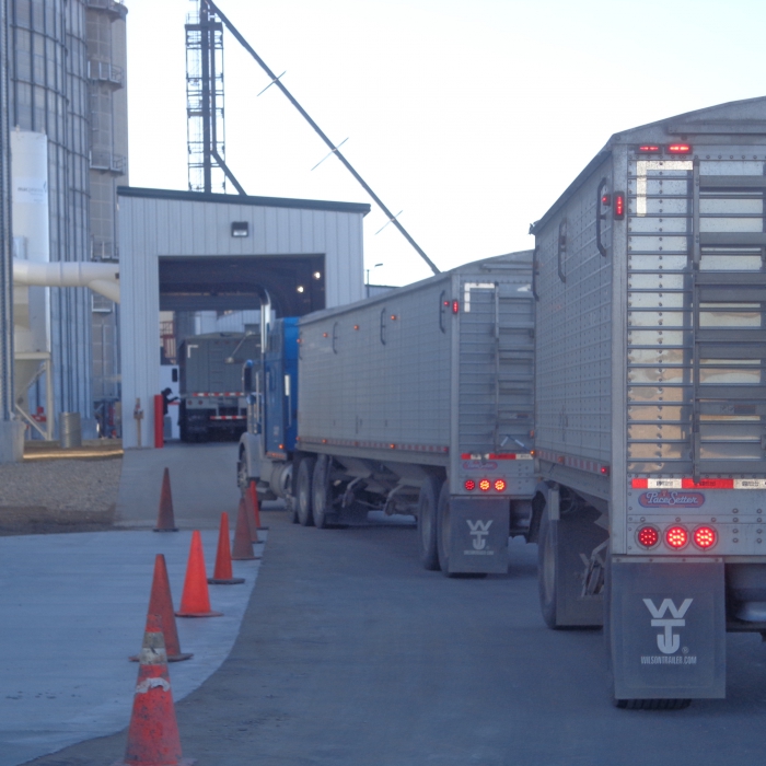 semi-trucks hauling equiptment to jobsite