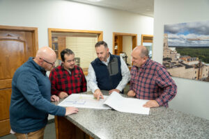 team members viewing blueprints