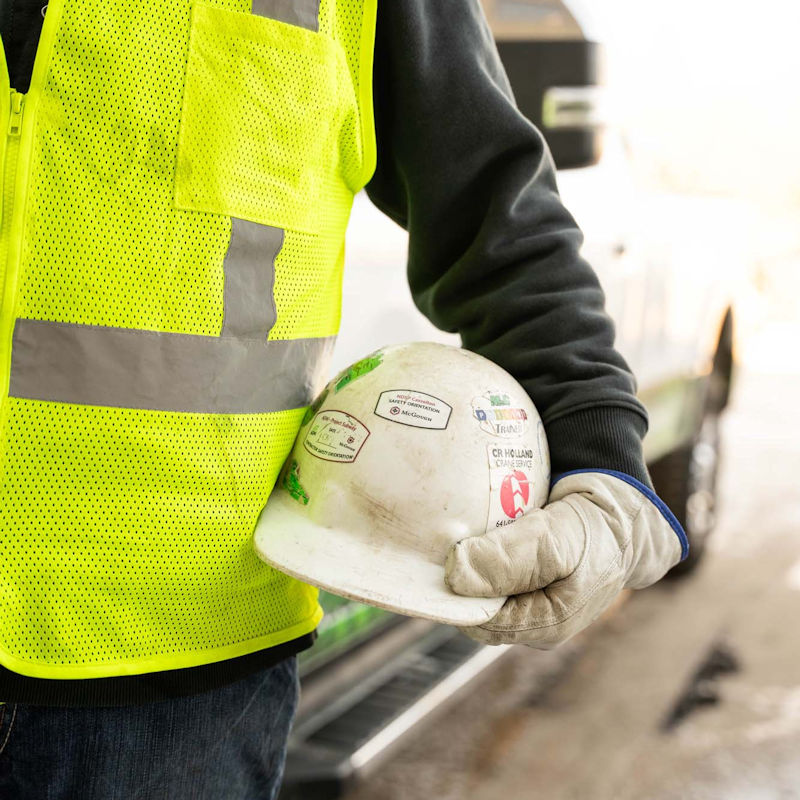 construction worker holding hard hat