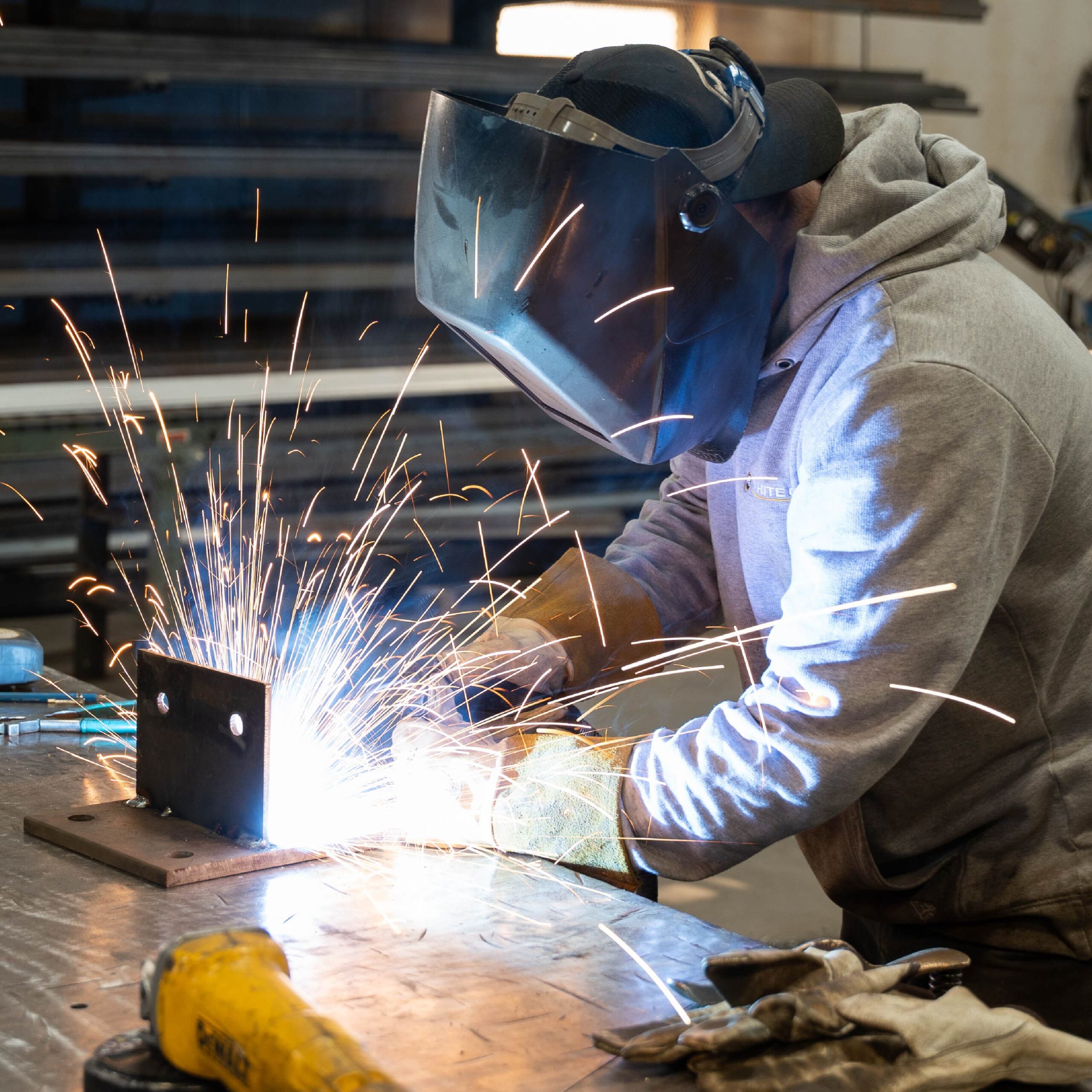 McCormick employee welding in fabrication shop